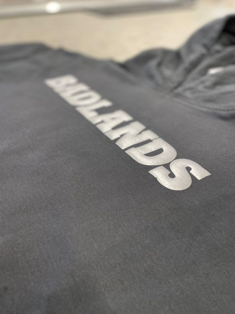 Vinyl – is a heat transfer process enabling you to create vibrant and bold designs.
This works very well with single-coloured designs and allows you to use styles like glitter, velvet flock and carbon style vinyls